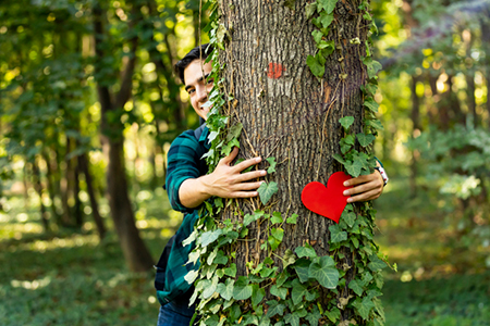 man hugging tree NoHo Senior Arts Colony apts for rent