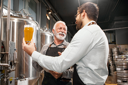men at brewery tanks NoHo Senior Arts Colony