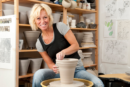 woman and pottery wheel noho senior arts colony